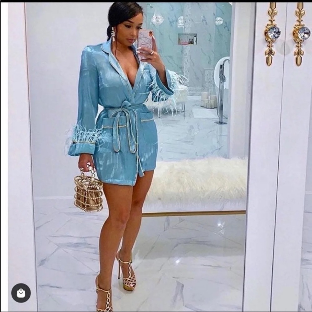 Aqua dress/ robe with gold trimming and feathers at end of sleeve